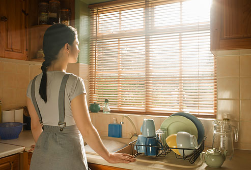 getty_rf_photo_of_woman_looking_through_window.jpg