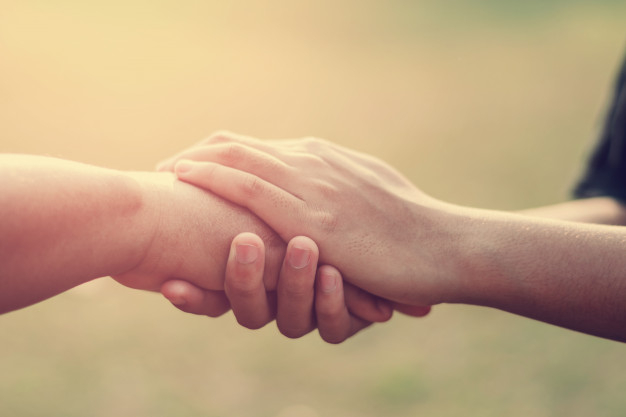 people-old-and-young-hand-holding-with-sunset-background_34152-356.jpg