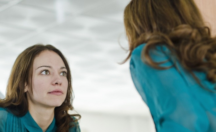 Woman-looking-at-mirror-740x450.jpg