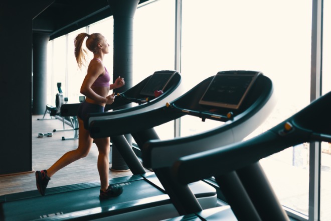 young-caucasian-woman-doing-exercise-with-dumbbells-while-training-arms-gym.jpg