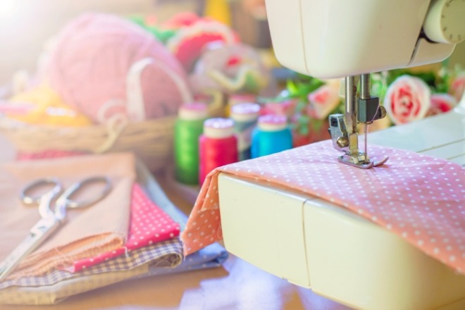 close-up-sewing-machine-working-with-pink-fabric.jpg