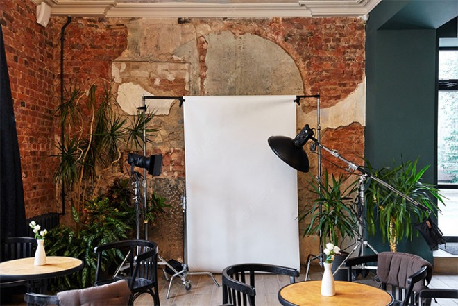 photo-studio-shooting-in-a-cafe-equipment-white-background-old-brick-walls_175935-501.jpg